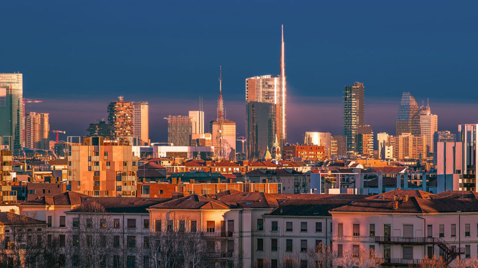 Cityscape of Milan kissed by a gold light at the sunset