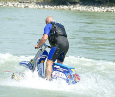 austrian-stuntman-daredevil-günter-schachermayr-on-his-vespa-px-being-pulled-on-the-water-by-speedboat