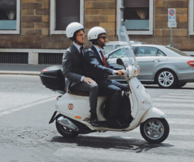 two-men-riding-on-motor-scooter-ptriq9lOJrM