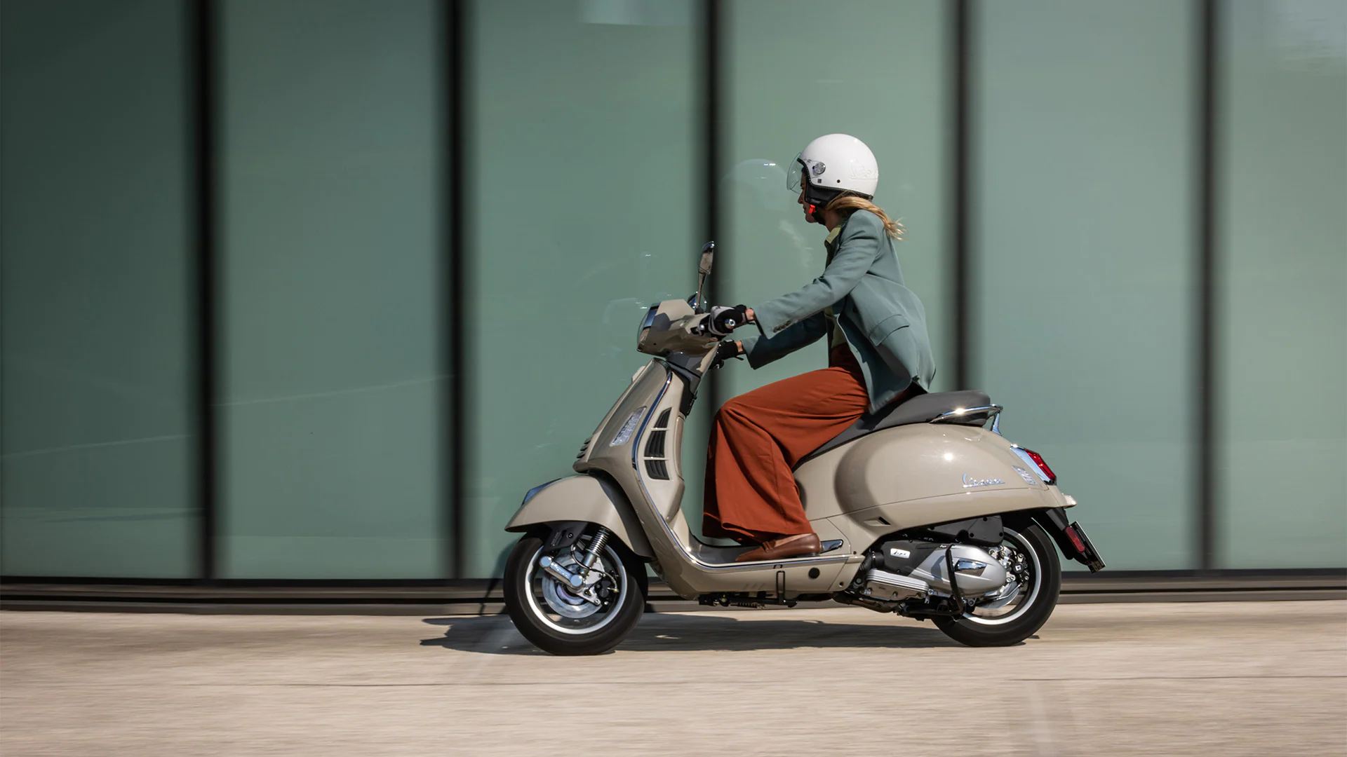 female-rider-on-modern-vespa-gts-300